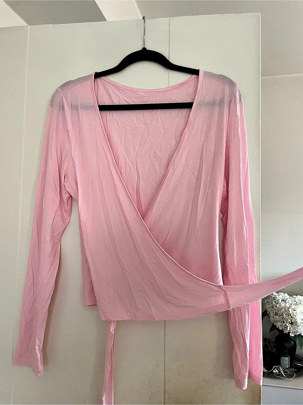 Pink long sleeve wrap top with tie waist